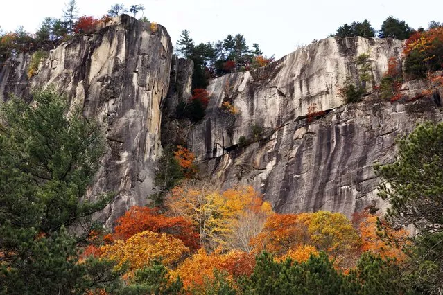 Fall colors are seen at New Hampshire's Cathedrel Ledge Monday, October 24, 2016, in Conway, N.H. (Photo by Jim Cole/AP Photo)