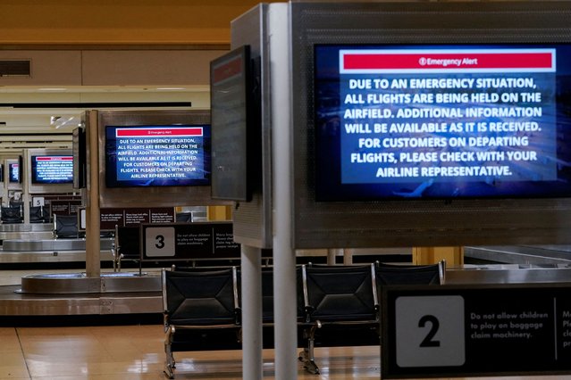 Emergency notices are displayed at the baggage claims area at Ronald Reagan National Airport, after American Eagle flight 5342 collided with a helicopter while approaching Ronald Reagan Washington National Airport and crashed in the Potomac River on January 30, 2025. (Photo by Nathan Howard/Reuters)