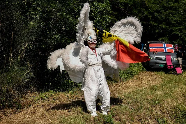 A spectator dressed in a fancy costume waves from the side of the route during the 15th stage of the 105th edition of the Tour de France cycling race, between Millau and Carcassonne on July 22, 2018. (Photo by Marco Bertorello/AFP Photo)