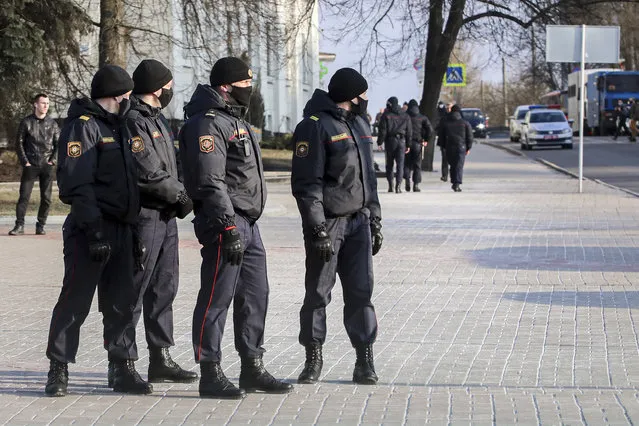 Police patrol a street to prevent a rally commemorating the founding of Belarus' 1918 proclamation of independence from Russia, in Minsk, Belarus, Thursday, March 25, 2021. (Photo by BelaPan via AP Photo)