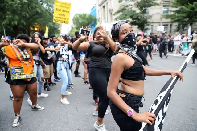 Counter protesters dance on H Street Northwest outside of Lafayette Park during the Unite the Right rally on August 12, 2018 in Washington, DC. Thousands of protesters are expected to demonstrate against the “white civil rights” rally, which was planned by the organizer of last year's deadly rally in Charlottesville, Virginia.(Photo by Alex Wroblewski/Getty Images)