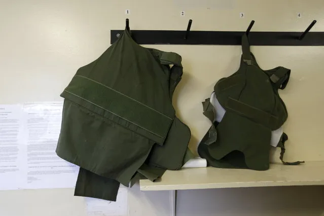 Protective vests are seen on a wall inside the Adjustment Center during a media tour of California's Death Row at San Quentin State Prison in San Quentin, California December 29, 2015. (Photo by Stephen Lam/Reuters)