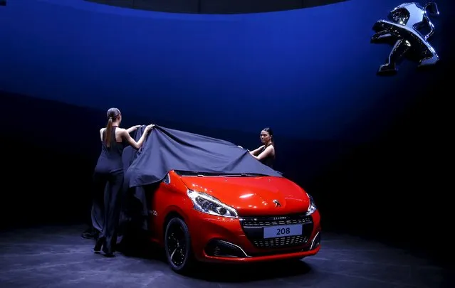 A Peugeot 208 is unveiled during the first press day ahead of the 85th International Motor Show in Geneva, Switzerland, in this March 3, 2015 file photo. PSA Peugeot Citroen is expected to report full-year sales volume this week. (Photo by Arnd Wiegmann/Reuters)