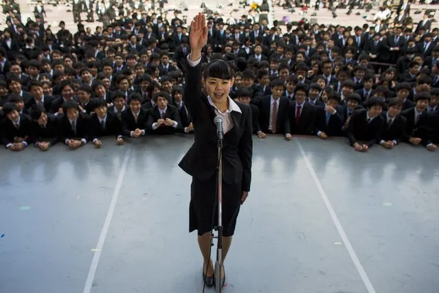 A Japanese college graduate publicly promises that she will do her best in trying to find work during a job-hunting rally at an outdoor theatre in Tokyo February 20, 2015. (Photo by Thomas Peter/Reuters)