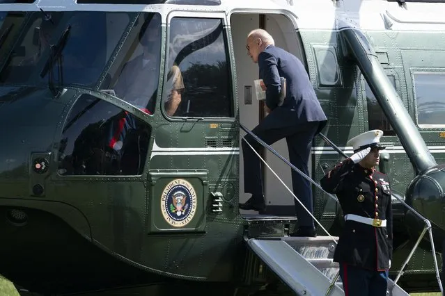 President Joe Biden boards Marine One on the Ellipse near the White House for a trip to Delaware, Wednesday, June 2, 2021, in Washington. (Photo by Evan Vucci/AP Photo)
