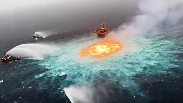 Shocking video showed the Gulf of Mexico boiling with bright orange flames underwater. The video went viral on Friday, July 2, 2021 as social media dubbed the orange flames “eye of fire” due to the blaze's circular shape. According to Pemex, the fire occurred roughly 150 yards from a drilling platform in the Yucatan peninsula. The company said the fire took more than five hours to extinguish. (Photo by BNO News)
