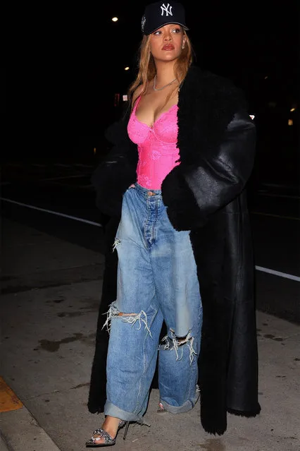 Rihanna rocks a lighter blonde hair style paired with a pink lace corset and a black coat as she steps out for dinner with friends at Italian eatery Giorgio Baldi in Santa Monica on January 15 2024. The 35-year-old singer is wearing a NY baseball cap, ripped blue jeans, a long black coat, a pink corset shimmering high heels. (Photo by GAMR/Backgrid USA)