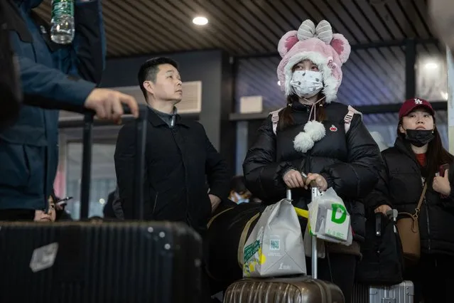 People wait in a departure hall at Wuhan Railway Station after some trains were suspended due to freezing rain and snow, in Wuhan in central China's Hubei province on February 4, 2024, amid peak travel ahead of the Lunar New Year of the Dragon which falls on February 10. (Photo by AFP Photo/China Stringer Network)