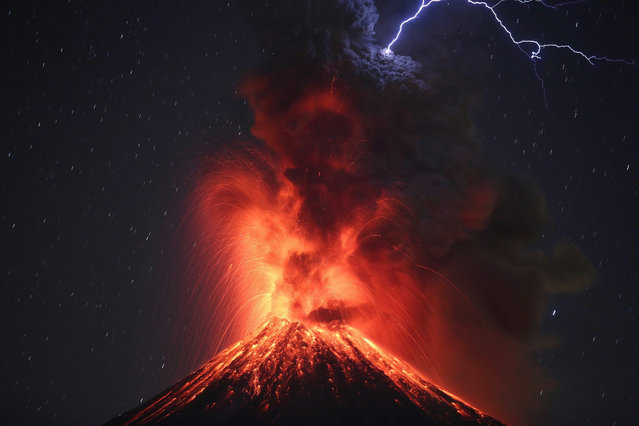 A picture taken with a slow shutter speed shows the Colima Volcano, the most active in Mexico, during an eruption as seen from the site of Carrizalillos, Colima, Mexico, 26 January 2017. The National Coordination of Civil Protection of the Ministry of Interior reported that since October 2016, the Colima volcano entered a mainly explosive stage of activity with irregular intervals, generating eruptive columns, with heights between one and four kilometers, sometimes with incandescent fragments launched one or two kilometers from the crater. (Photo by Ulises Ruiz Basurto/EPA)