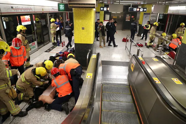 An injured person is under medical treatment inside a subway station in Hong Kong, China February 10, 2017. (Photo by Apple Daily/Reuters)