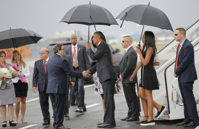 U.S. President Barack Obama (C) shakes hands with Cuba's foreign minister Bruno Rodriguez as Obama and his family arrived at Havana's international airport for a three-day trip, in Havana March 20, 2016. (Photo by Carlos Barria/Reuters)