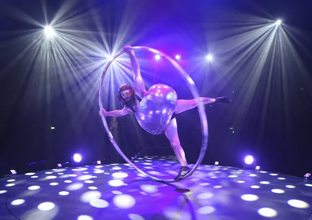 Antoine Carabinier-Lepine, a cast member of Canada's Cirque Alfonse, performs with a hoop during a preview of their show “BARBU” in Sydney, Wednesday, February 8, 2017. The show is described as “A sеxy lumberjack pirate circus party” and will run at the Sydney Opera House until March. (Photo by Rick Rycroft/AP Photo)