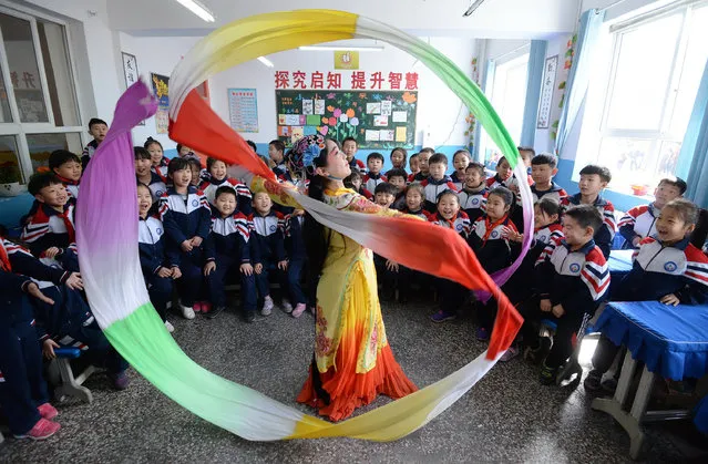 Students celebrating World Drama Day in Handan, Hebei province, China on March 27, 2019. (Photo by Costfoto/Barcroft Images)