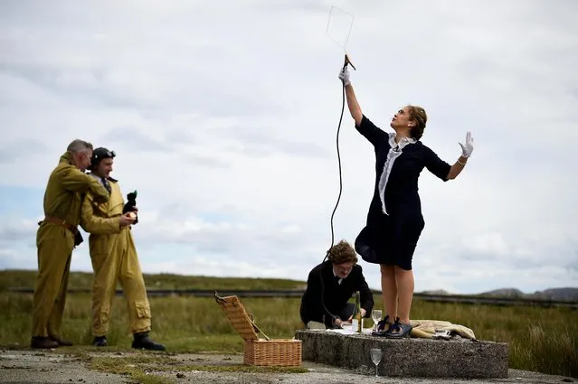 Actors playing Guglielmo Marconi and his wife Annie Jameson look for wire signal during a recreation welcoming the first non-stop transatlantic flight by British aviators Sir John Alcock and Sir Arthur Whitten-Brown that began on June 14, 1919 departing from Newfoundland, Canada, and crash landed on June 15, 1919 in the Connemara bog of Derrygimlagh, during the 100th anniversary of the flight, in Derrygimlagh, Ireland, June 15, 2019. (Photo by Clodagh Kilcoyne/Reuters)