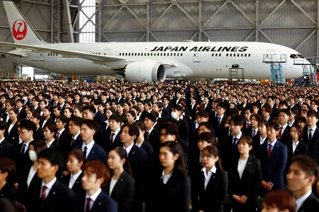 Newly hired employees of Japan Airlines (JAL) group attend an initiation ceremony at a hangar of Haneda airport in Tokyo, Japan, on April 1, 2024. (Photo by Issei Kato/Reuters)