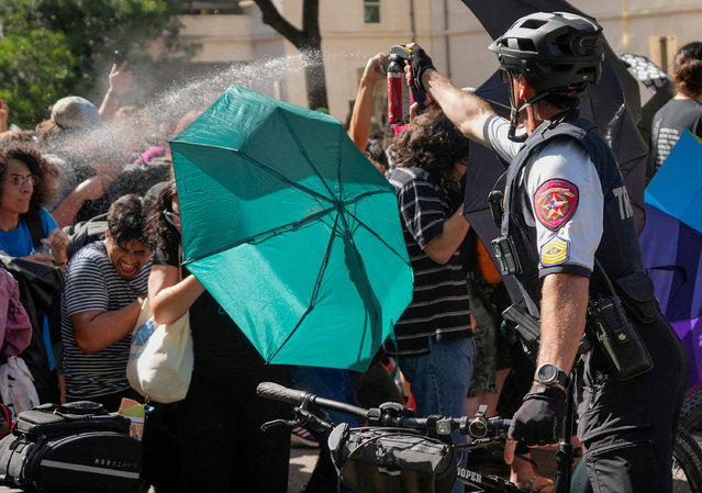 A state trooper pepper sprays pro-Palestinian protesters, during the ongoing conflict between Israel and the Palestinian Islamist group Hamas, at the University of Texas in Austin, Texas, U.S. April 29, 2024. (Photo by Jay Janner/American-Statesman/USA Today Network via Reuters)