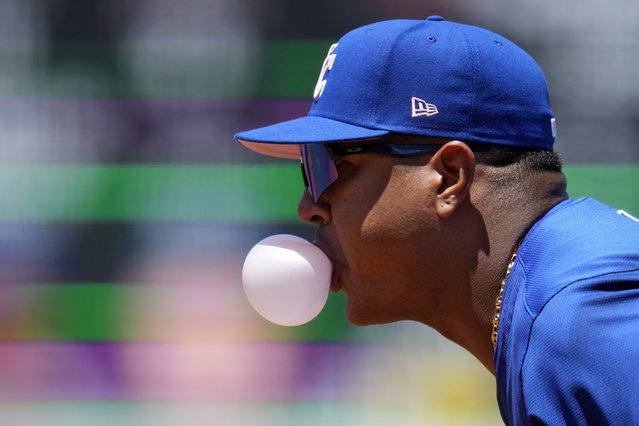 Kansas City Royals first baseman Salvador Perez blows a bubble during the second inning of a baseball game against the Los Angeles Angels Sunday, May 12, 2024, in Anaheim, Calif. (Photo by Ashley Landis/AP Photo)