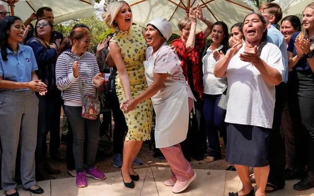 White House adviser Ivanka Trump dances with a woman in a courtyard after holding a woman's economic empowerment event in Asuncion, Paraguay on September 6, 2019. (Photo by Kevin Lamarque/Reuters)