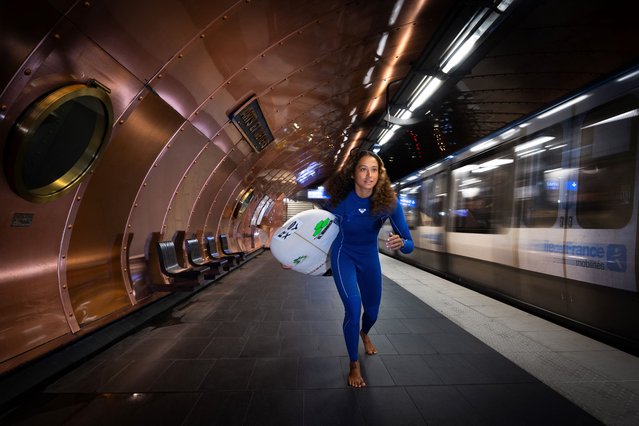 France's surfer Vahine Fierro poses on the platform of The Arts et Metiers metro station in Paris, on March 13, 2024, ahead of the Paris 2024 Olympic and Paralympic games. The Arts et Metiers metro station was opened October 19, 1904 as part of the first section of Line 3. (Photo by Stefano Rellandini/AFP Photo)