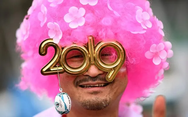 A Japan supporter poses outside the Shizuoka Stadium Ecopa in Shizuoka ahead of the Japan 2019 Rugby World Cup Pool A match between Japan and Ireland on September 28, 2019. (Photo by Anne-Christine Poujoulat/AFP Photo)