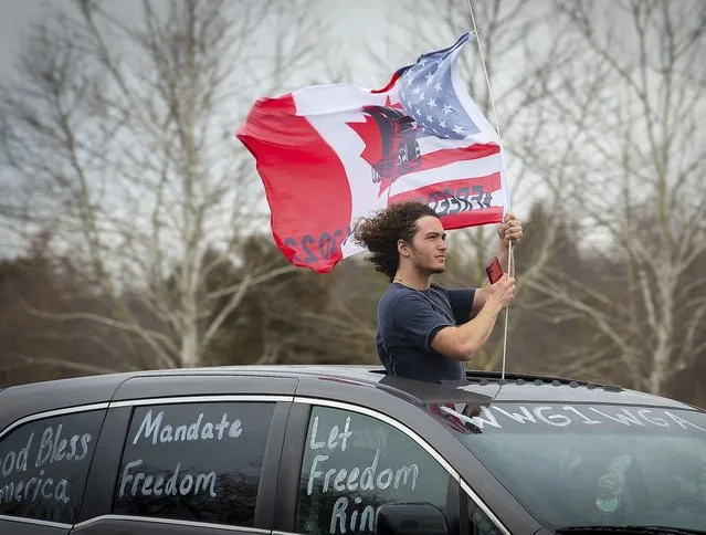 Supporters drive near the New Design Road bridge over I-270 in Frederick County as the “People’s Convoy” passed through the county as they make their way from Hagerstown to Washington, Sunday, March 6, 2022. (Photo by Bill Green/The Frederick News-Post via AP Photo)