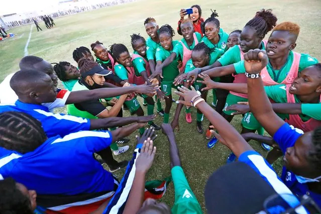South Sudan's players huddle together during a FIFA women's football friendly match between Sudan and South Sudan at Jebel Awliaa stadium in Sudan's capital Khartoum on February 16, 2022. Sudan's women national team was officially created in 2021, around two years following the ouster of Islamist president Omar al-Bashir whose three-decade rule which saw little freedoms for women. The team has since took part of the Arab Women's Cup 2021 playing against Egypt, Tunisia, and Lebanon. They also played Algeria in October, and South Sudan this month. (Photo by Ashraf Shazly/AFP Photo)