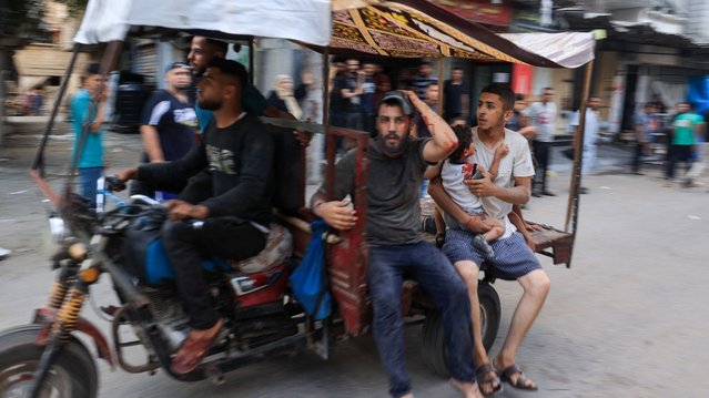 A tuktuk driver rushes to transport casualties after Israeli bombardment at al-Bureij refugee camp in the central Gaza Strip on July 8, 2024, amid the ongoing conflict between Israel and the Palestinian Hamas militant group. (Photo by Eyad Baba/AFP Photo)