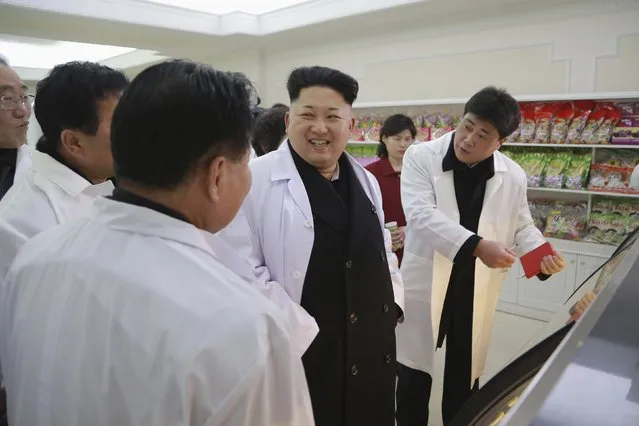 North Korean leader Kim Jong Un (C) provides field guidance at Kumkop General Foodstuff Factory for Sportspersons in this undated photo released by North Korea's Korean Central News Agency (KCNA) in Pyongyang January 18, 2015. (Photo by Reuters/KCNA)