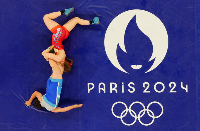 Amit Elor of Team United States (red) competes with Sol Gum Pak of Team Democratic People’s Republic of Korea (blue) during the Wrestling Women's Freestyle 68kg Semifinal on day ten of the Olympic Games Paris 2024 at Champs-de-Mars Arena on August 05, 2024 in Paris, France. (Photo by Kim Kyung-Hoon/Reuters)