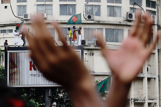 People celebrate the resignation of Bangladeshi Prime Minister Sheikh Hasina in Dhaka, Bangladesh, on August 5, 2024. (Photo by Mohammad Ponir Hossain/Reuters)