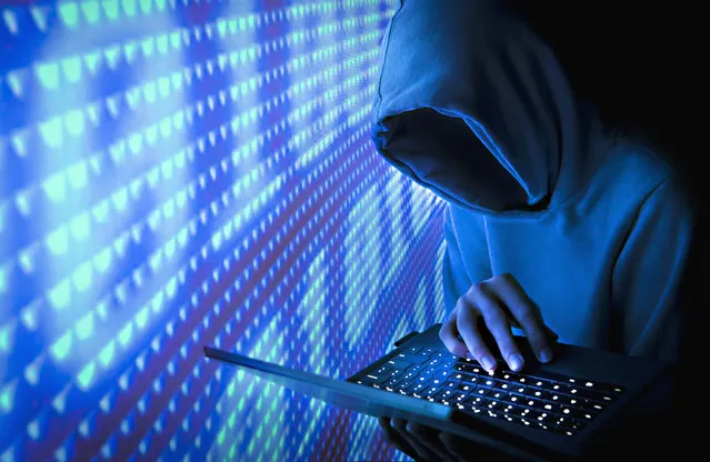 Faceless computer hacker. (Photo by Bill Hinton/Getty Images)