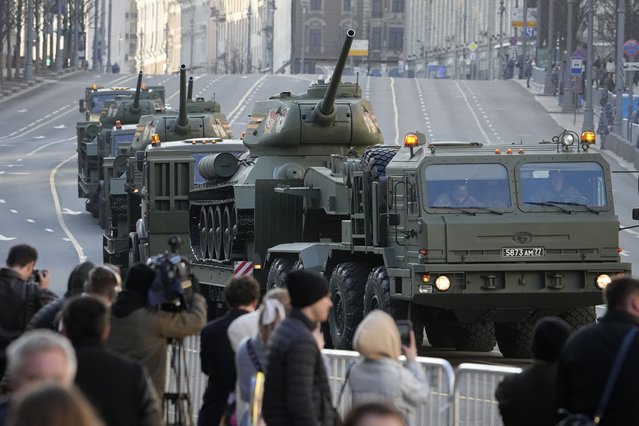 Soviet T-34 tanks are transported along Tverskaya street toward Red Square to attend a rehearsal for the Victory Day military parade in Moscow, Russia, Wednesday, May 4, 2022. The parade will take place at Moscow's Red Square on May 9 to celebrate 77 years of the victory in WWII. (Photo by Alexander Zemlianichenko/AP Photo)