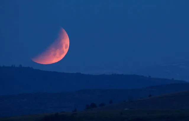 The moon is seen during lunar eclipse in Skopje, North Macedonia on May 16, 2022. (Photo by Ognen Teofilovski/Reuters)