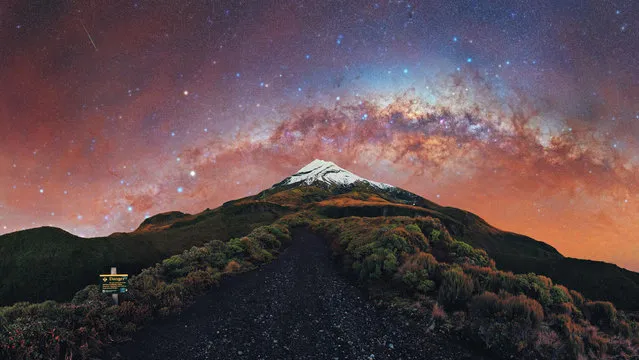 Galactic Kiwi – Mount Taranaki, New Zealand. “Under the arch of the setting Milky Way. I had shot at this location before but felt I could do better, so I returned on an unexpected trip to give it another go. I was pleasantly surprised to find the skies had cleared up by the morning and proceeded to hike up and shoot from this spot on the Puffer. While it’s not a perfect alignment with the Milky Way, it was still my first setting arch of the year. There were even a few meteors flying around and I caught some of them on my frames”. (Photo by Evan McKay/Milky Way Photographer of the Year)