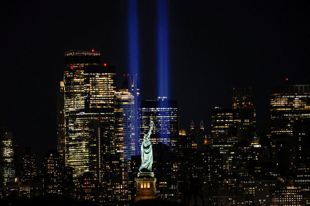 The Tribute in Light is illuminated on the skyline of lower Manhattan on the day of the 23rd anniversary of the September 11, 2001 attacks on the World Trade Center, as viewed from Bayonne, New Jersey, U.S., September 11, 2024. (Photo by Eduardo Munoz/Reuters)