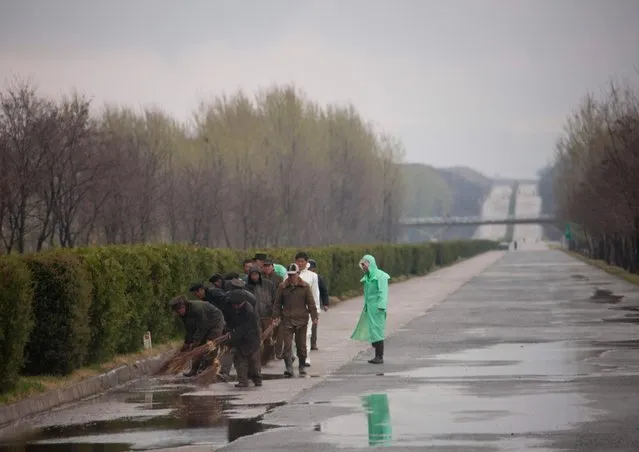 Workers on the highway were reparaing the road on the left side. (Photo by Eric Lafforgue/Exclusivepix Media)