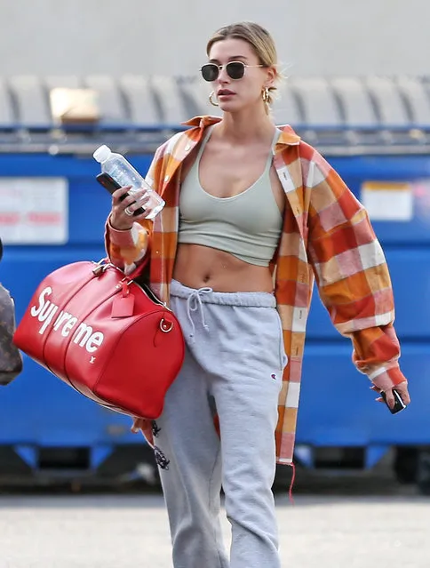 Model Hailey Bieber leaving dance studio in Los Angeles on January 29, 2020 wearing casual grey joggers and tartan / plaid open buttoned shirt. (Photo by ENT/Splash News and Pictures)