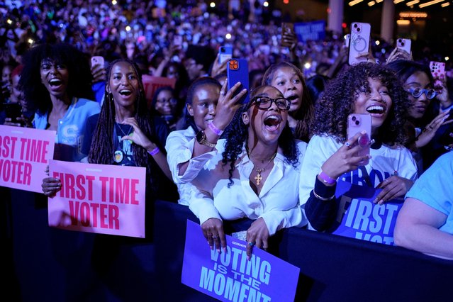 Supporters react as Former U.S. first lady Michelle Obama hosts a rally for Democratic presidential nominee U.S. Vice President Kamala Harris at Gateway Center Arena in College Park, Georgia, U.S. October 29, 2024. (Photo by Cheney Orr/Reuters)