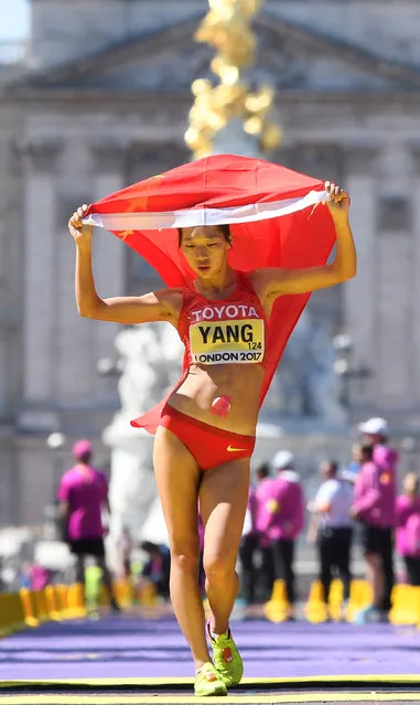 Bronze medallist China' s Shuqing Yang finishes the women' s 50 km race walk athletics event at the 2017 IAAF World Championships on The Mall in central London on August 13, 2017. (Photo by Toby Melville/Reuters)