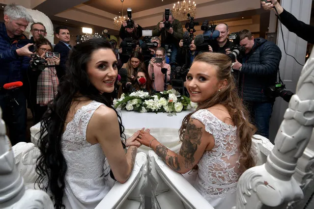 Robyn Peoples (R) and Sharni Edwards (L) face the media after they became Northern Ireland's first legally married same s*x couple on February 11, 2020 in Carrickfergus, Northern Ireland. Following a change in the laws in the absence of a power sharing executive government in the province concerning same s*x marriage late last year, Northern Irish couples can now get legally married from today. (Photo by Charles McQuillan/Getty Images)