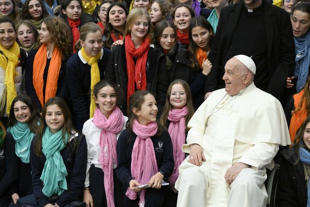 Pope Francis poses with little girls during his Wednesday General Audience at Paul VI Hallon December 18, 2024 in Vatican City, Vatican. With the opening of the Holy Door less than 6 days away, Pope Francis holds his weekly General Audience and begins the cycle of catechesis that will mark the entire Jubilee Year, focusing on “Jesus Christ, our hope”. (Photo by Vatican Media via Vatican Pool/Getty Images)
