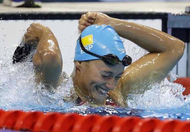 Spain's Mireia Belmonte Garcia celebrates after winning the gold medal in the women's 200-meter butterfly final during the swimming competitions at the 2016 Summer Olympics, Wednesday, August 10, 2016, in Rio de Janeiro, Brazil. (Photo by Michael Sohn/AP Photo)