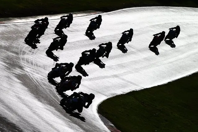 The field enters Graham Hill Bend at the start of the Ducati Performance TriOptions Cup at Brands Hatch on October 16, 2022 in Longfield, England. (Photo by Ker Robertson/Getty Images)