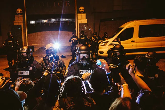 Protesters surround the police head quarters to protest against police brutality, the killing of George Floyd and were calling for the firing of the police officers involved in the hit-and-run of several protesters the night before, on June 14, 2020 in Richmond, United States. George Floyd died on May 25th when he was in Minneapolis police custody, sparking nationwide protests. A white police officer, Derek Chauvin, has been charged with second-degree murder, with the three other officers involved facing other charges. (Photo by Eze Amos/Getty Images)