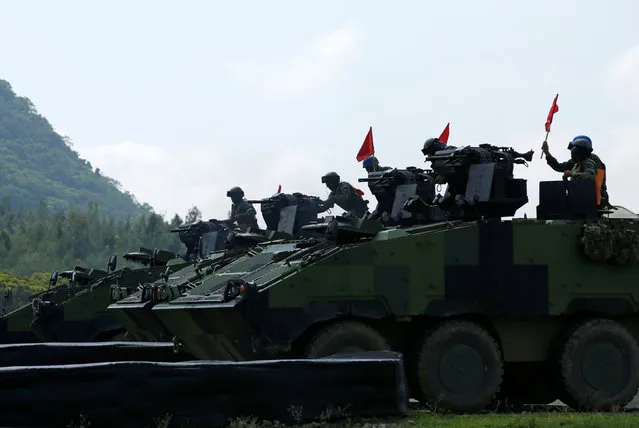 Soldiers drive CM33 “Clouded Leopard” infantry fighting vehicle during annual Han Kuang military drill simulating the China's People's Liberation Army (PLA) invading the island, in Pingtung county, southern Taiwan August 25, 2016. (Photo by Tyrone Siu/Reuters)