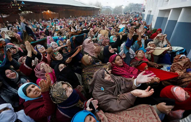 Kashmiri Muslims react upon seeing a relic, that's believed to be hair from the beard of the Islamic prophet Mohammed, being displayed during the festival of Eid-e-Milad-ul-Nabi, the birth anniversary of the prophet, at Hazratbal shrine in Srinagar December 1, 2017. (Photo by Danish Ismail/Reuters)