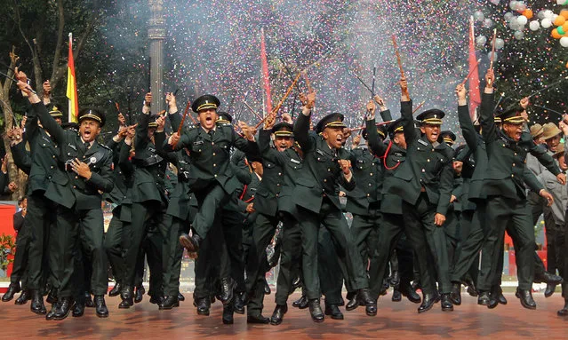 Indian army cadets celebrate after their graduation ceremony at the Officers Training Academy (OTA) in Gaya on December 9, 2017. (Photo by AFP Photo/Stringer)