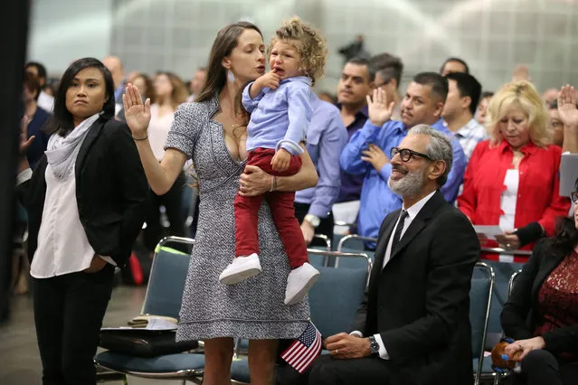 Actor Jeff Goldblum sits with his wife Emilie Livingston from Canada and their 22-month-old son Charlie Ocean Goldblum as Livingston is sworn in as a new U.S. citizen at a naturalization ceremony in Los Angeles, May 23, 2017. (Photo by Lucy Nicholson/Reuters)
