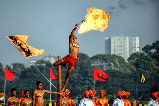 Indian Army officials perform stunts with Fire during the forthcoming “Vijay Diwas” celebrations, at the Royal Calcutta Turf Club (RCTC) in Kolkata, India on December 15, 2022. “Vijay Diwas” is celebrated every year on December 16 to honor the victory of Indian armed forces over Pakistan in the 1971 Bangladesh liberation war. Eastern Command of the Indian Army celebrates Vijay Diwas (Victory day) which is on December 16 to commemorate the Indian Armed Forces Victory in Bangladesh Liberation War along with Bangladesh Army against Pakistan in the year 1971. (Photo by Avishek Das/SOPA Images/Rex Features/Shutterstock)