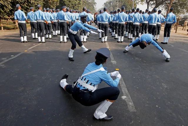 Indian Air Force officers stretch before taking part in full dress rehearsal for India's Republic Day parade in Kolkata, January 23, 2018. (Photo by Rupak De Chowdhuri/Reuters)